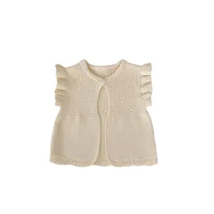 Chic knit baby vest in cream white with ruffled wing sleeves and a single button closure
