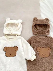 Close-up of baby teddy fleece sweatshirt with cute bear embroidery and matching ear hat