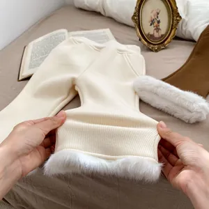 Close-up showing the high elasticity and soft fur trim of the girls fleece flared pants