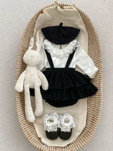 Baby girls floral lace collar top and ruffled dress set with beret and shoes in flat lay