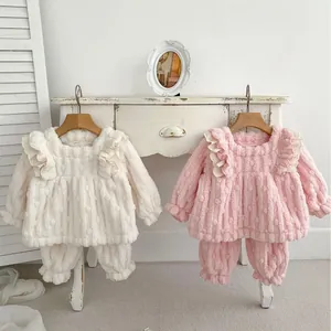 Winter fleece loungewear set for baby girls featuring ruffled shoulders and textured fabric