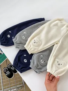 Detailed waffle knit fabric texture and cute bear embroidery on toddler casual pants