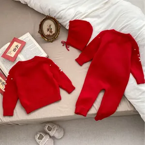 Infant red knit bodysuit set with handmade flowers and matching hat for New Year