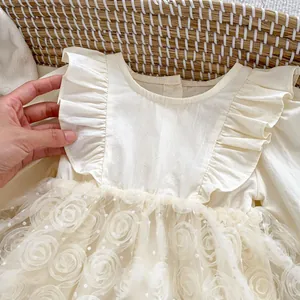 Detail of baby princess romper with layered dot mesh skirt and 3D floral accents