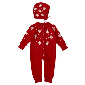 Red knit baby romper and hat set with delicate white floral embroidery for New Year