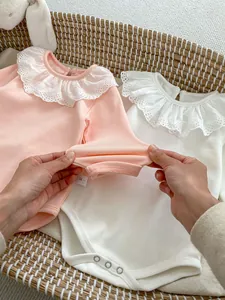 Soft cotton long sleeve baby bodysuit with lace collar in pink and white colors