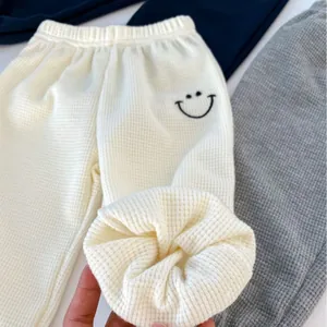 Boys' waffle knit jogger pants with elastic waist and smile face embroidery detail