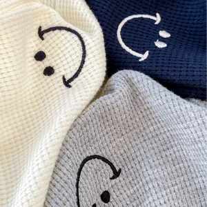 Kids waffle knit joggers with smiley face embroidery in beige, blue and grey colors