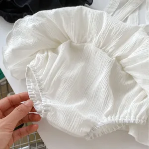 White ruffle bloomer skirt for baby girls with soft texture and elastic leg openings