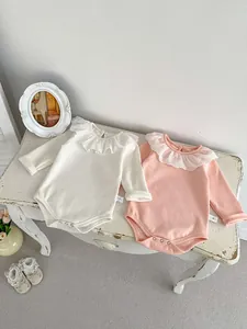 Long sleeve cotton baby bodysuits with lace ruffle collars in cream and pink