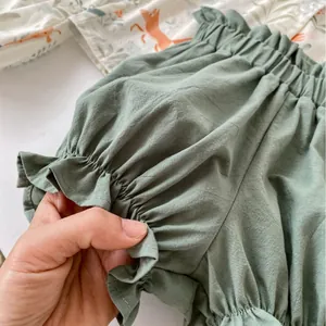 Infant summer outfit with fox print shirt and sage green ruffle shorts set for babies