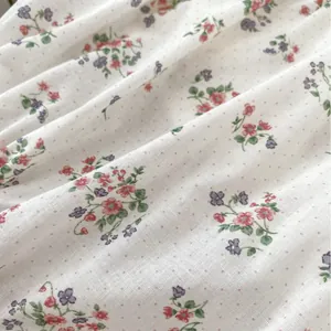 Floral print cotton baby bodysuit featuring vintage embroidery and wide ruffled collar