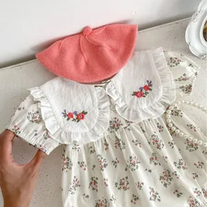 Floral baby girl romper with oversized embroidered Peter Pan collar and puff sleeves