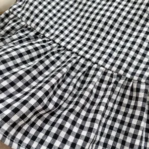 Baby girl summer set featuring black and white gingham sleeveless top and bloomer shorts