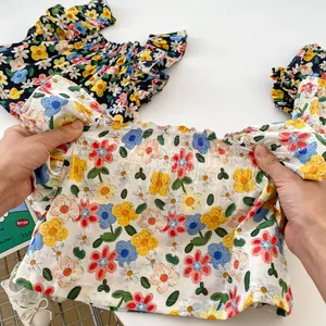 Summer baby girl floral sleeveless top with elastic neckline in navy and cream color