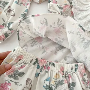 Floral baby girl romper with pink roses, butterfly prints and delicate lace waist