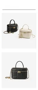 Detail of quilted leather mini box bags with gold chain straps in black and white
