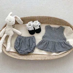 Flat lay of baby girl gingham sleeveless top and bloomer set with plush bunny