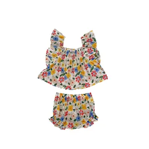 Infant floral two-piece set with ruffle sleeve top and bloomers on white background