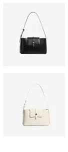 Detailansicht der glatten Leder-Achseltaschen mit eleganten runden Metallschnallen in Schwarz und Beige