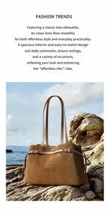 Detailed view of brown suede tote bag with leather straps and metal buckle on seaside rocks