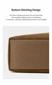 Detailed shot of reinforced stitching on the bottom of a brown suede tote bag