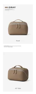 Detail view of genuine leather toiletry bag with top handles and pebble texture