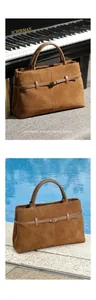 Detailed view of brown suede tote bag with decorative buckle in indoor and outdoor settings