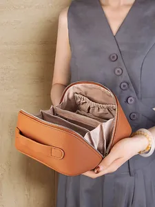 Caramel genuine leather travel cosmetic bag with large capacity and layered inner pockets