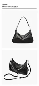 Dettaglio borsa hobo a mezzaluna in pelle nera con manico intrecciato e trama