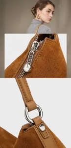 Nahaufnahme der Silberbeschläge und des Reißverschlusses an brauner Leder-Shopper