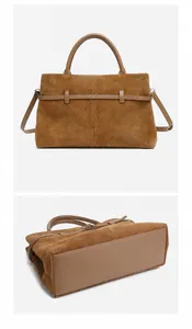 Detailed back and bottom view of brown matte leather tote with smooth leather handles