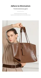 Detail of genuine brown leather tote bag showing minimalist design and fine texture