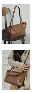 Detailed view of a brown leather tote bag with flap cover and metal rivet accents