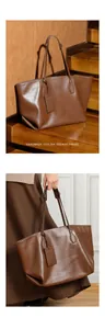 Detailed view of large brown genuine leather tote bag with stylish handmade finish