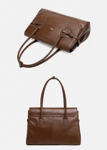 Dettaglio borsa tote in pelle martellata marrone scuro con fibbia dorata raffinata