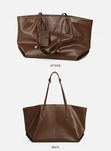 Detail view of large brown leather tote bag showing 45-degree side and back angles
