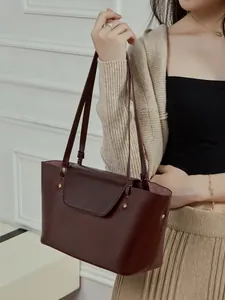 Classic burgundy leather tote bag with long shoulder straps for women's daily commute