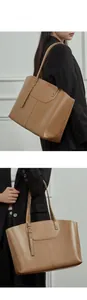 Detail of a brown leather tote bag with a layered flap pocket and metal rivets