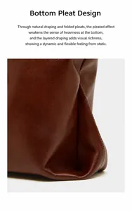 Detail of the pleated base and smooth stitching on this dark brown leather tote bag