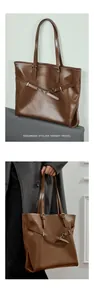 Detail of dark brown vegetable-tanned leather tote with vintage gold buckles and straps
