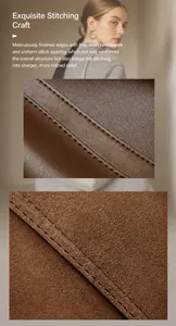 Detail view of premium brown leather tote showing reinforced double-stitching and grain texture