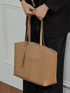 Classic camel leather tote bag with contrast stitching and shoulder strap for women