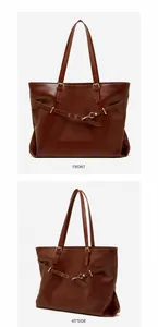 Detailed front view of coffee brown leather tote bag with thin straps and metallic buckle