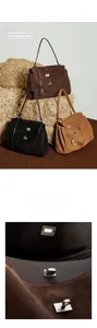 Detailed view of large matte leather tote bags with distinctive metal twist locks