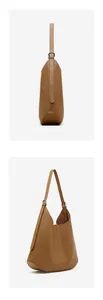 Detail view of caramel leather shoulder bag with adjustable strap and stitching