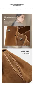 Detailed view of silver metal hardware and adjustable side buckles on brown suede tote bag