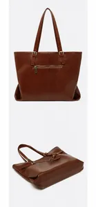 Detail of vintage brown leather tote bag showing back zipper pocket and wide bottom view