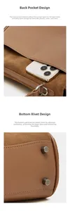 Detail view of the brown leather tote bag showing back pocket and protective metal studs