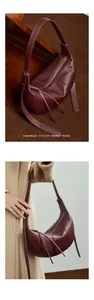 Detail of burgundy leather hobo bag featuring tassel zipper and adjustable shoulder strap